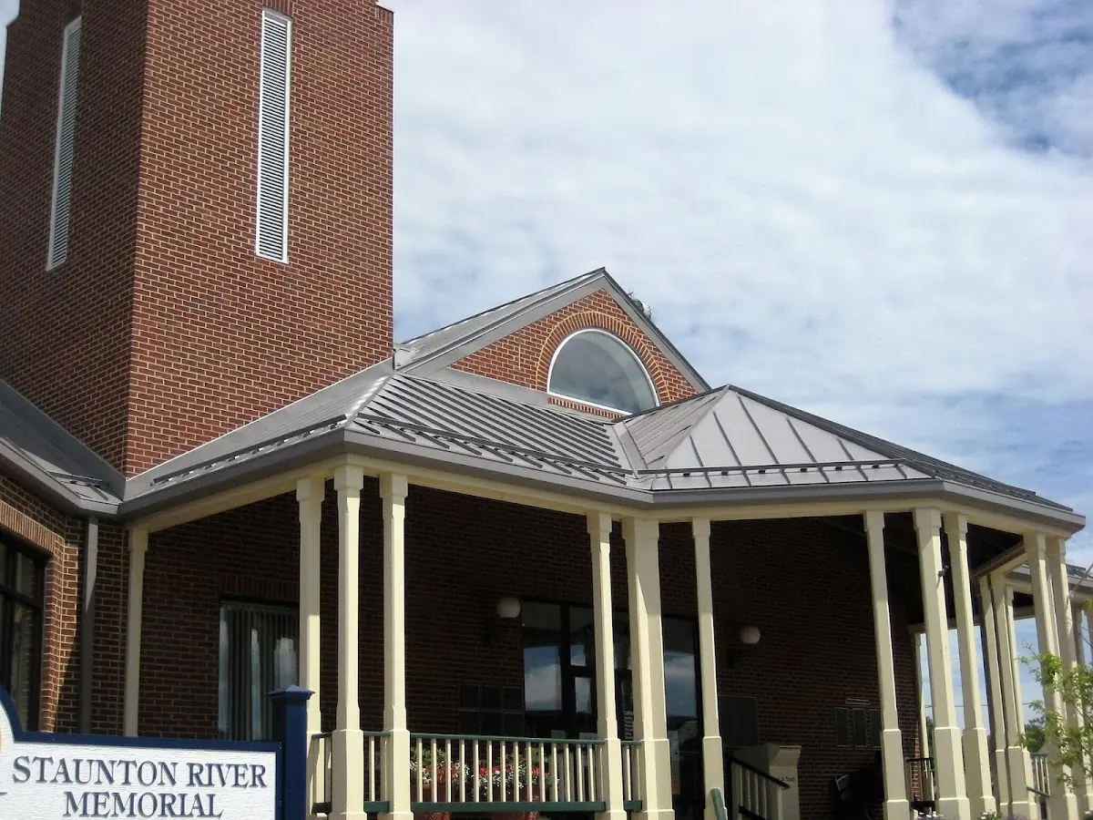 Skilled roofing craftsmen working on a residential roof in North Virginia - Socrates